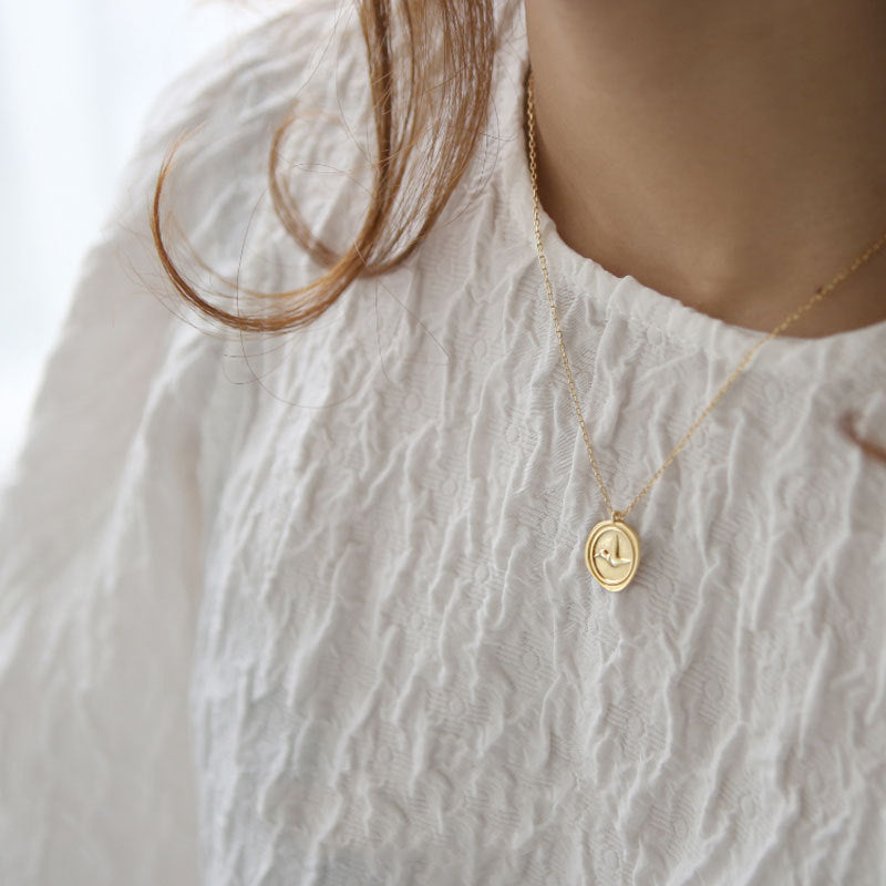 Sterling Silver Bird Coin Necklace