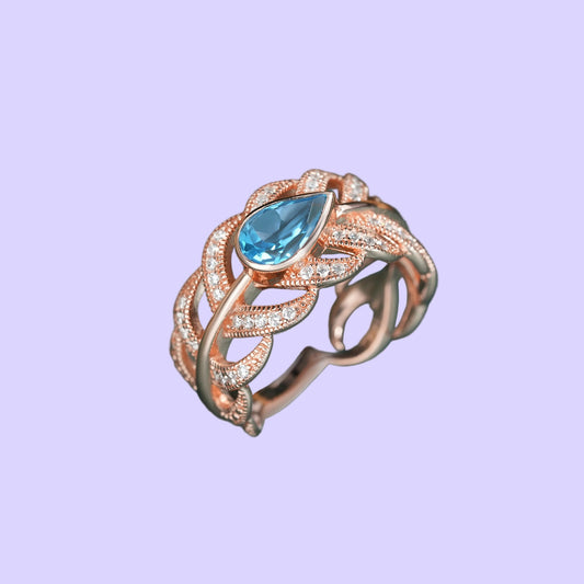 Adjustable Sterling Silver Swiss Blue Topaz Feather Ring