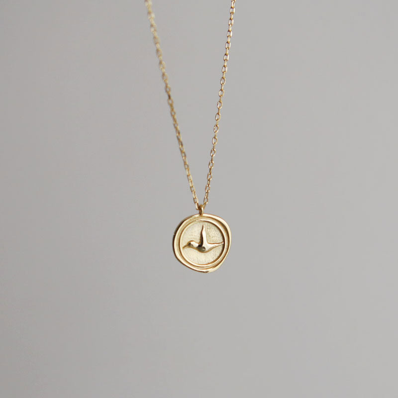 Sterling Silver Bird Coin Necklace